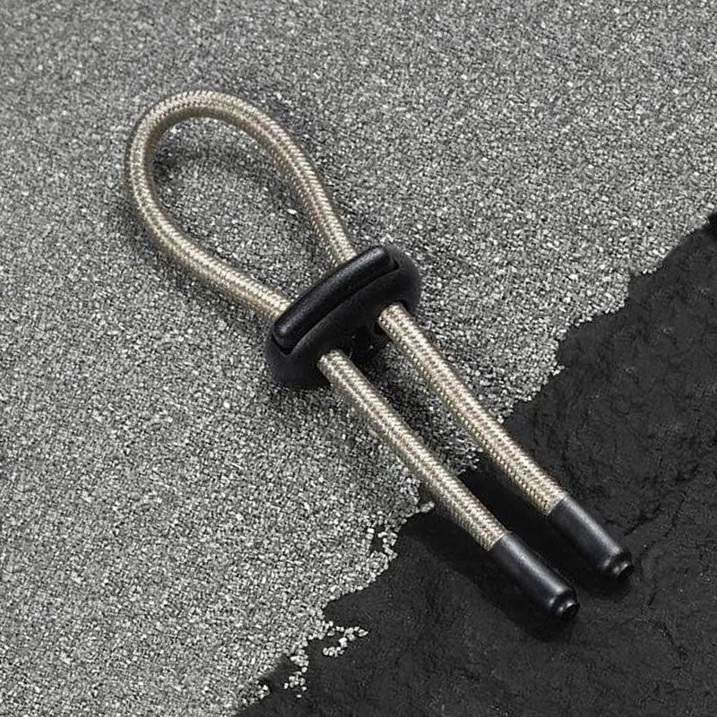 COnductive rubber loop with silver sleeve design on a textured surface