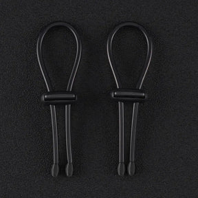 Pair of 4mm conductive rubber loops with elasticated conductive core on a dark background