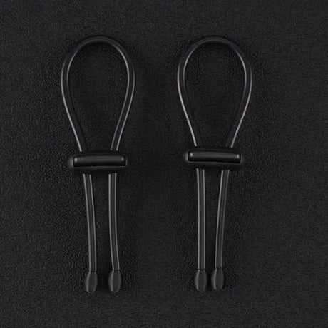 Pair of 4mm conductive rubber loops with elasticated conductive core on a dark background
