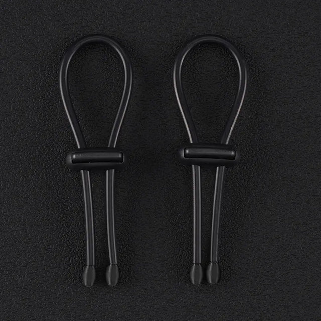 Pair of 4mm conductive rubber loops with elasticated conductive core on a dark background