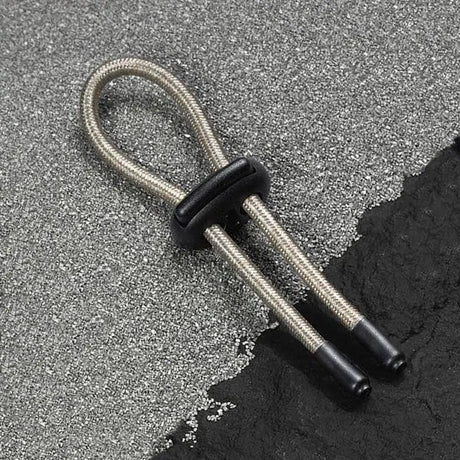 COnductive rubber loop with silver sleeve design on a textured surface