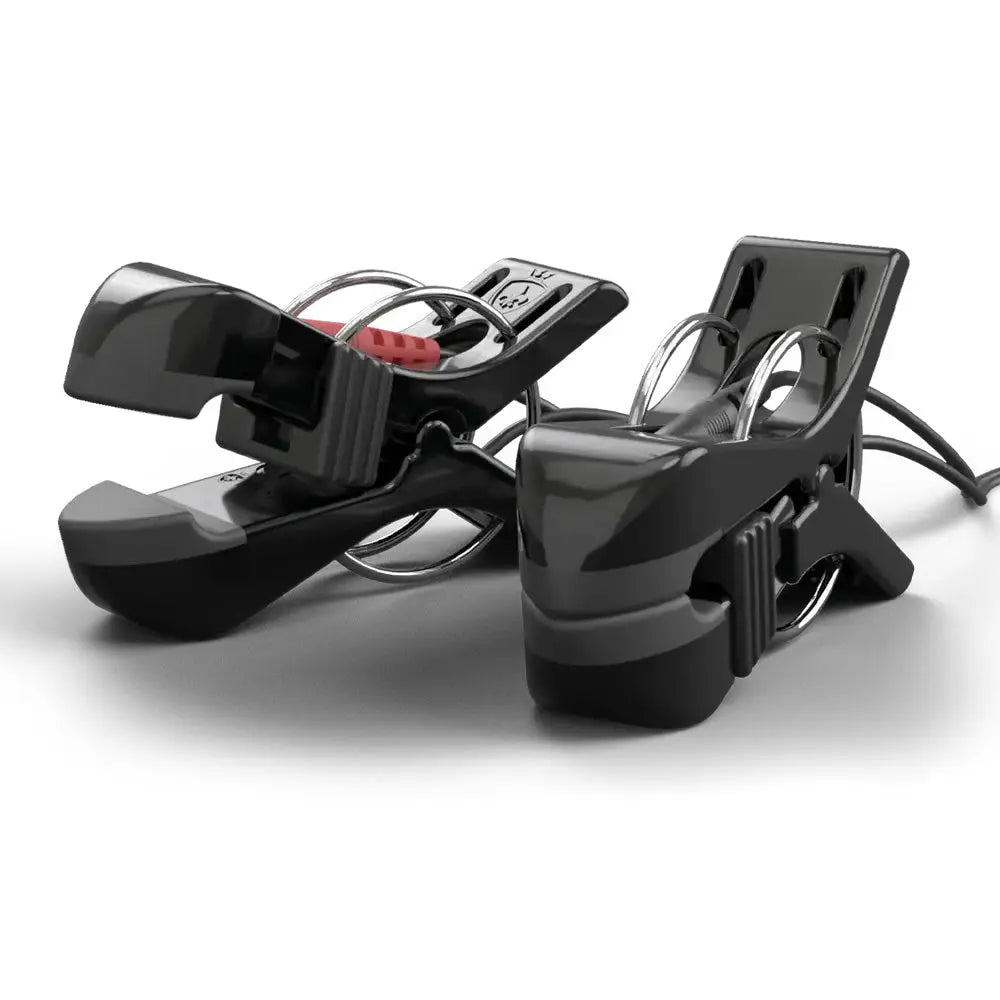 Two black electric clothes clips with metal spring-loaded jaws and visible power cords, photographed on a clean white studio background.