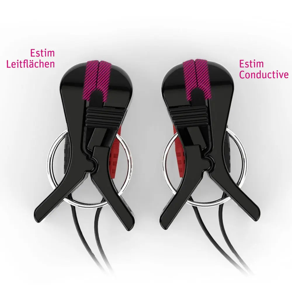 Two black electrode clip devices with pink textured strips and red inner padding, shown on a white background with German text labels 'Estim Leitflächen' and 'Estim Conductive'.