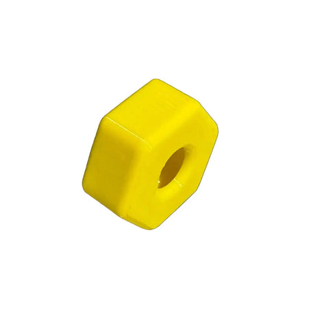Yellow plastic block with a circular hole on a black background